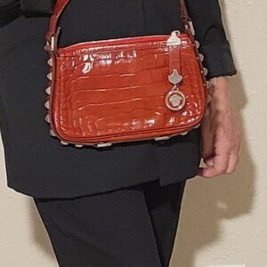 Red crocodile-embossed leather bag from Versace